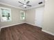 Bright bedroom with wood floors and ceiling fan at 161 Laynewade Rd, Polk City, FL 33868
