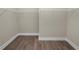 Large walk-in closet with wire shelving and wood-look flooring at 161 Laynewade Rd, Polk City, FL 33868
