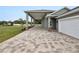 House exterior showcasing paver driveway and covered walkway at 161 Laynewade Rd, Polk City, FL 33868