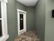 Front entryway with modern door and paver flooring at 161 Laynewade Rd, Polk City, FL 33868