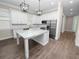 Modern kitchen featuring white cabinets and granite countertops at 161 Laynewade Rd, Polk City, FL 33868