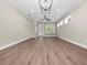 Spacious living room featuring hardwood floors and a modern chandelier at 161 Laynewade Rd, Polk City, FL 33868