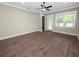 Living room with hardwood floors and access to an outdoor patio at 161 Laynewade Rd, Polk City, FL 33868