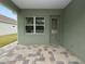 Covered patio with paver stones and a view of the backyard at 161 Laynewade Rd, Polk City, FL 33868