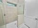 Shower with glass enclosure and hexagon tile floor at 234 Laynewade Rd, Polk City, FL 33868