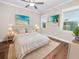 Main bedroom with wood-look floors and beach decor at 234 Laynewade Rd, Polk City, FL 33868