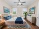 Bright bedroom with a king-size bed and wood flooring at 234 Laynewade Rd, Polk City, FL 33868