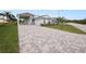 House exterior showcasing a paved driveway and landscaping at 234 Laynewade Rd, Polk City, FL 33868