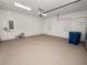 Clean and bright garage with painted floor and extra space at 234 Laynewade Rd, Polk City, FL 33868