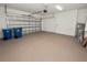 Spacious garage with ample storage space and overhead door at 234 Laynewade Rd, Polk City, FL 33868