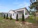 Side view of a single-story home with covered patio at 234 Laynewade Rd, Polk City, FL 33868