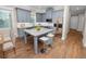 Modern kitchen with gray cabinets, granite island, and stainless steel appliances at 234 Laynewade Rd, Polk City, FL 33868