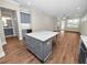 Modern kitchen with gray cabinets, granite island, and stainless steel appliances at 234 Laynewade Rd, Polk City, FL 33868