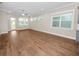 Bright living room with wood-look floors and exterior access at 234 Laynewade Rd, Polk City, FL 33868