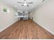 Open living room features wood-look floors and kitchen views at 234 Laynewade Rd, Polk City, FL 33868