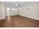 Living room with wood-look floors and access to backyard at 234 Laynewade Rd, Polk City, FL 33868