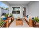 Relaxing covered patio with wicker furniture and potted plants at 234 Laynewade Rd, Polk City, FL 33868