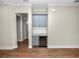 Built-in wet bar with wine cooler, gray cabinets, and granite countertop at 234 Laynewade Rd, Polk City, FL 33868