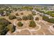 Aerial view of community featuring walking trails and lush landscape at 252 Magneta Loop, Auburndale, FL 33823