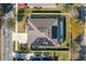 Home's roofline and solar panels are visible in this overhead view at 252 Magneta Loop, Auburndale, FL 33823