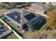 Aerial view of property featuring a screened-in pool and solar panels at 252 Magneta Loop, Auburndale, FL 33823