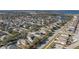 Aerial view of a house with solar panels situated in a residential neighborhood at 252 Magneta Loop, Auburndale, FL 33823