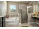 Modern bathroom featuring a soaking tub and a walk-in shower at 252 Magneta Loop, Auburndale, FL 33823