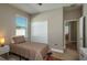 A cozy bedroom with a twin bed, a window with blinds, and a closet at 252 Magneta Loop, Auburndale, FL 33823