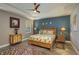Spacious bedroom with king-size bed, ceiling fan and accent wall at 252 Magneta Loop, Auburndale, FL 33823