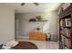 A home office with built-in shelves, neutral walls, and a round table at 252 Magneta Loop, Auburndale, FL 33823