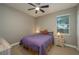 Bedroom with a queen bed, ceiling fan, and ample natural light at 252 Magneta Loop, Auburndale, FL 33823