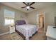 Cozy bedroom featuring a comfortable bed and en-suite bathroom access at 252 Magneta Loop, Auburndale, FL 33823