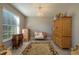 Common area with leopard print rug, love seat, and armoire at 252 Magneta Loop, Auburndale, FL 33823