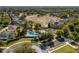 Aerial view of community pool and surrounding homes at 252 Magneta Loop, Auburndale, FL 33823