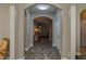 Bright and spacious entry hall with tile flooring and arched doorways at 252 Magneta Loop, Auburndale, FL 33823
