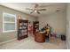 Bright home office with built-in bookcases and a large desk at 252 Magneta Loop, Auburndale, FL 33823