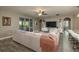 A comfortable living room with a large sectional sofa, TV, and access to the patio at 252 Magneta Loop, Auburndale, FL 33823