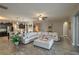 Open living room with sectional sofa and view into kitchen at 252 Magneta Loop, Auburndale, FL 33823