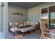 Covered patio with comfortable seating area at 252 Magneta Loop, Auburndale, FL 33823