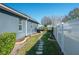 Landscaped side yard with stone path at 252 Magneta Loop, Auburndale, FL 33823