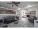 Open concept living room with stone fireplace and hardwood floors at 2591 Edmond Cir, Auburndale, FL 33823