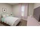Charming bedroom with pink accents and a white bed frame at 3146 Laurel Oak Ln, Winter Haven, FL 33884