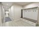 Bright entryway with built-in bench seating and storage at 3146 Laurel Oak Ln, Winter Haven, FL 33884