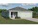 One-story home with light green exterior, two-car garage, and landscaping at 3146 Laurel Oak Ln, Winter Haven, FL 33884