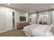 Main bedroom with sliding door to patio and large TV at 3146 Laurel Oak Ln, Winter Haven, FL 33884