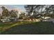 View of the house from backyard at dusk at 3150 Dove Ln, Mulberry, FL 33860