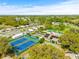 Aerial view of community tennis courts and clubhouse at 32334 Oak Park Dr, Leesburg, FL 34748