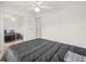 Spacious bedroom with mirrored closet doors and double bed at 32334 Oak Park Dr, Leesburg, FL 34748
