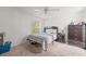 Bright bedroom with double bed and ceiling fan at 32334 Oak Park Dr, Leesburg, FL 34748