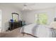 Bedroom with double bed, dresser, and ceiling fan at 32334 Oak Park Dr, Leesburg, FL 34748